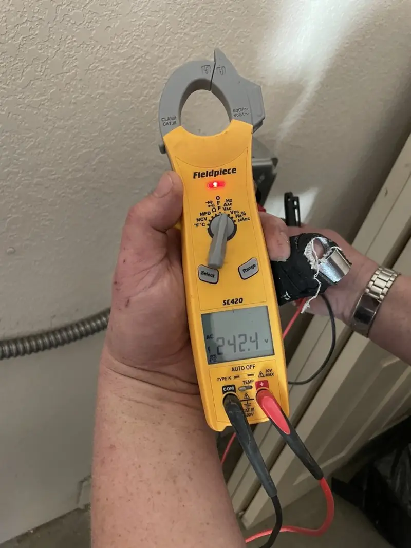 Voltage testing with clamp meter during Electrical Installation Services in Turlock